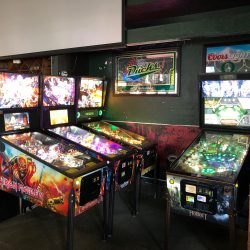 Different themed pinball machines that are ready for action